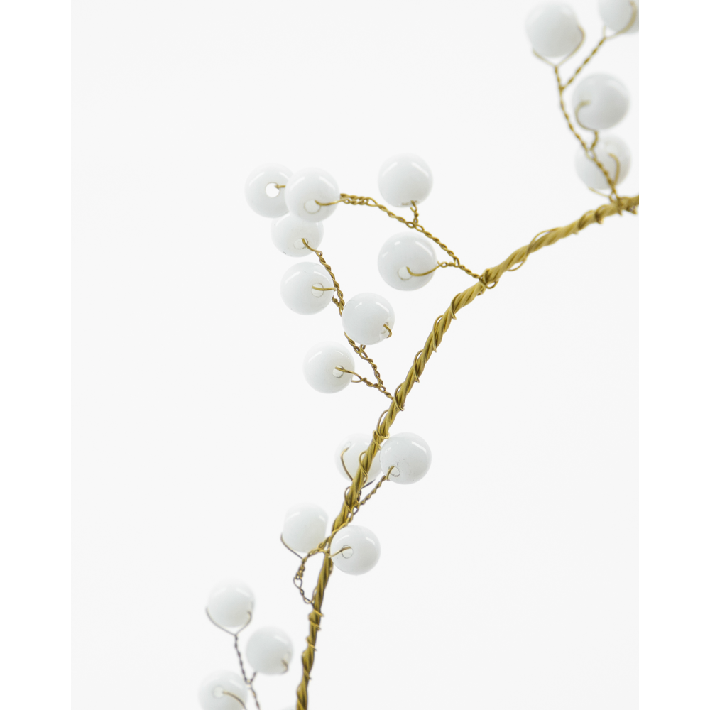 A House Doctor Christmas Ornament, Bird in White & Brass, featuring a decorative branch made of twisted brass wire with small, white glass beads.