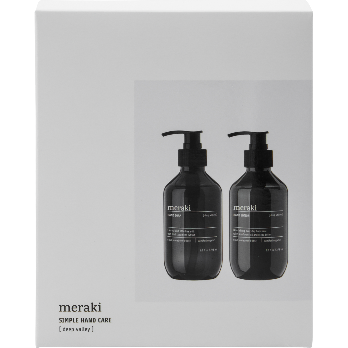 A white gift box features two black Meraki pump bottles. The box reads, "Gift Box Deep Valley, Hand Care Set with Hand Soap & Hand Lotion," offering a touch of organic luxury for your daily hand care routine.