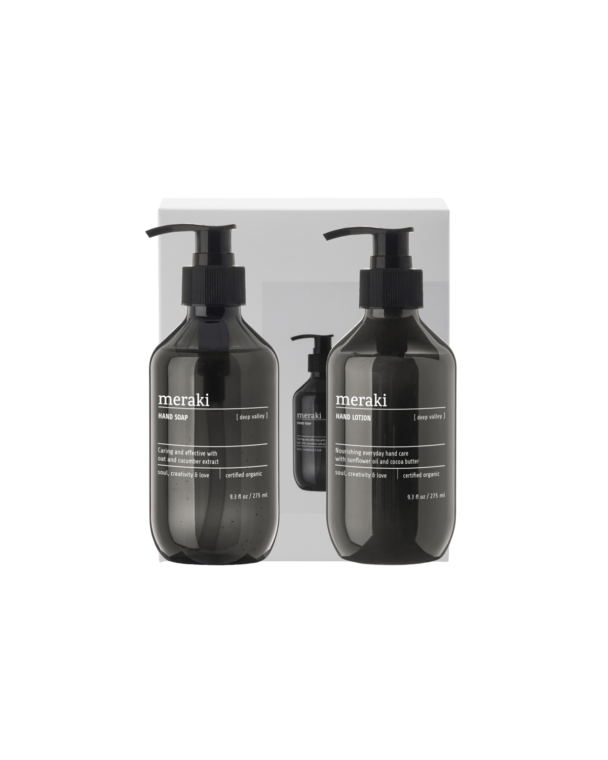 The Meraki Gift Box Deep Valley contains black pump bottles of hand soap and hand lotion, all featuring a minimalist white and gray design for elegant hand care.