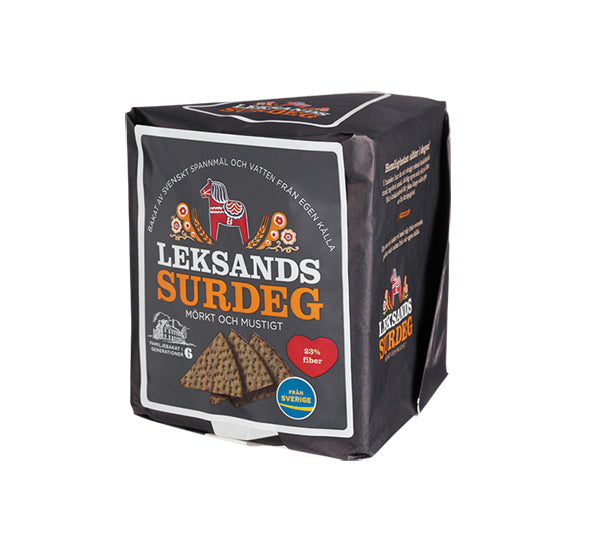 A dark, rectangular pack of Deli Leksands Surdeg – Sourdough Crispbread 200g features gourmet crispbread slices and a red Dala horse, highlighting high fiber, natural ingredients, and vegan-friendly Swedish crispbread.