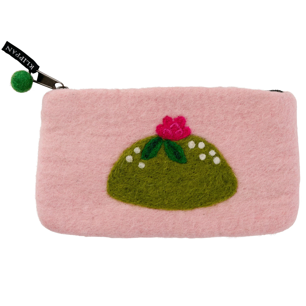 The Felted Wool Purse Princess Cake from Klippan Yllefabrik is a handmade zip pouch crafted from pink felted wool, featuring a green hill with a red flower and white dots inspired by traditional Swedish fika treats. A playful felt pompom adorns the zipper pull, capturing the whimsical charm of a Princess cake.