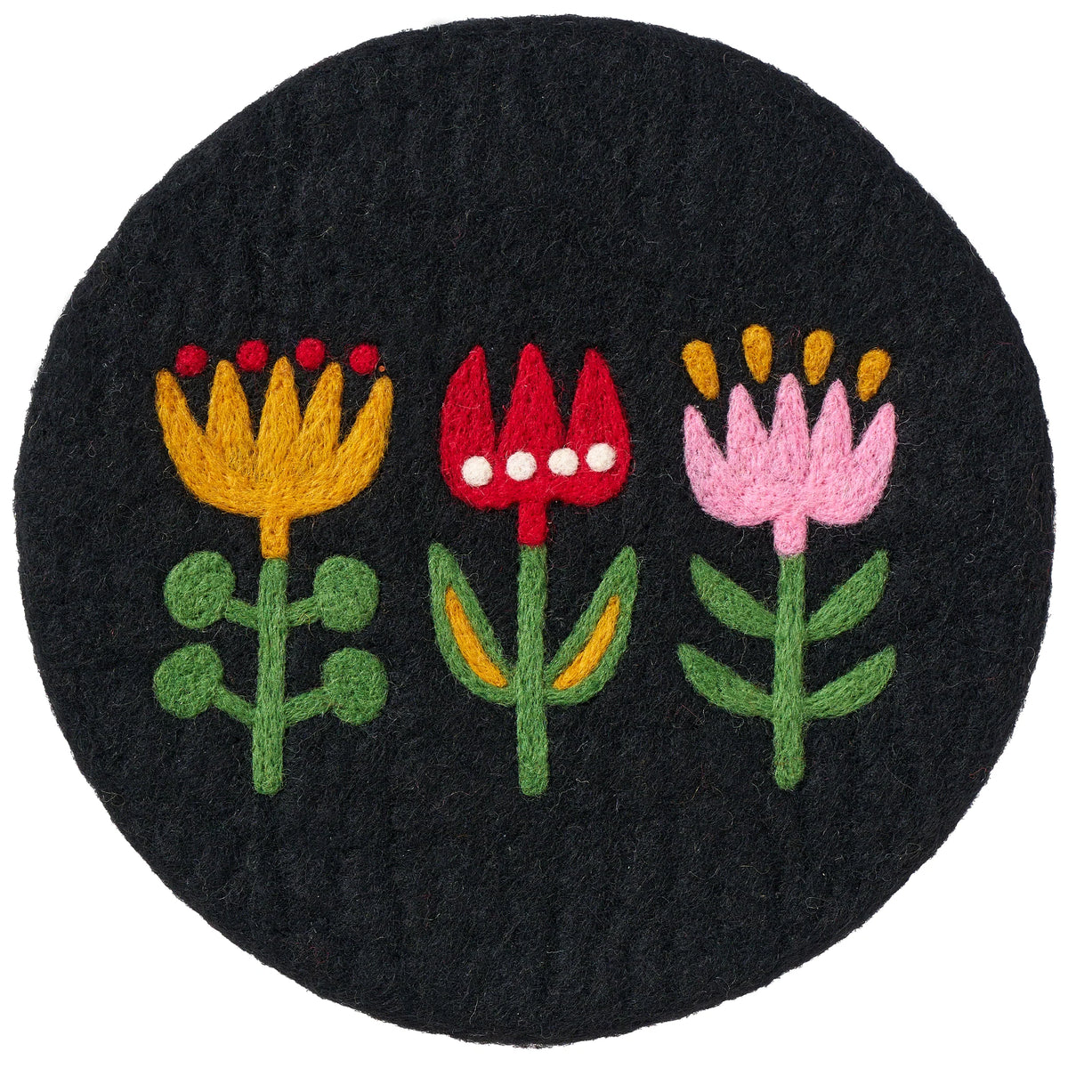 The Klippan Yllefabrik Felted Wool Pot Mat Holder Tulip in Black is a handmade, round pot mat featuring three embroidered tulip flowers: one yellow with green leaves, one red with white dots and green leaves, and one pink with yellow dots and green leaves.