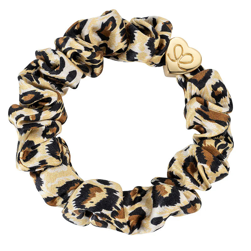 The ByEloise Silk Scrunchie Gold Heart · Leopard is crafted from luxurious silk and finished with a striking gold heart charm for elegant style.