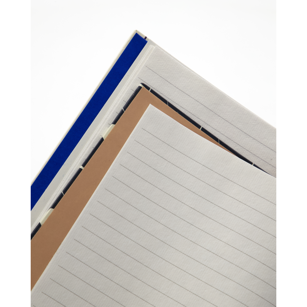 The House Doctor Notebook/Journal, Sand & Birds set includes two stylish notebooks—perfect for daily planning—with unique covers, shown stacked and fanned out on a white background.