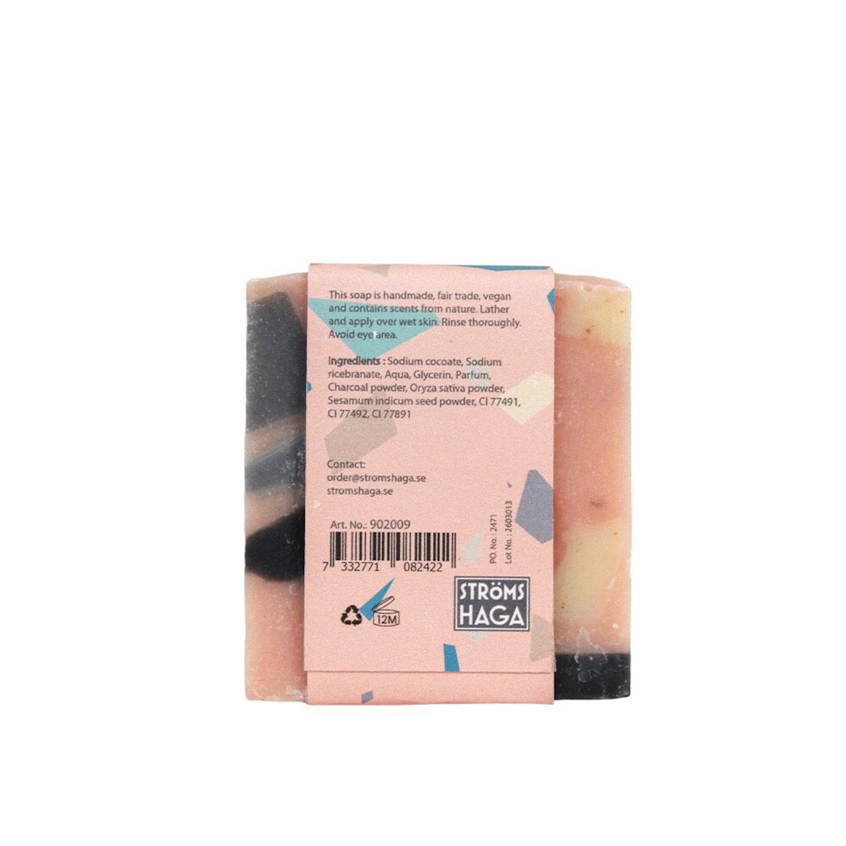A rectangular, handmade Terrazzo Soap Bar from Strömshaga features beautiful pink, black, and cream swirls. Its label details ingredients, instructions for use, exfoliating benefits, and fair trade credentials. Delicately scented with rose geranium mango for a refreshing experience.