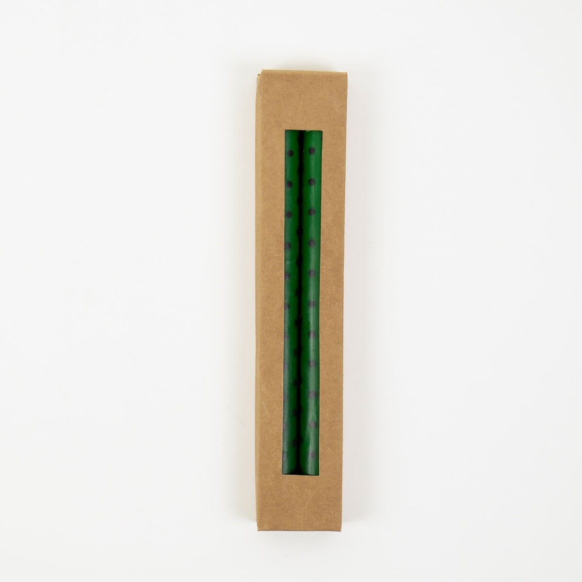 A World of Craft Candles Minidot Green & Black, Handmade 2 Pack: two green handmade taper candles with black polka dots in a rectangular cardboard gift box with a cutout window.