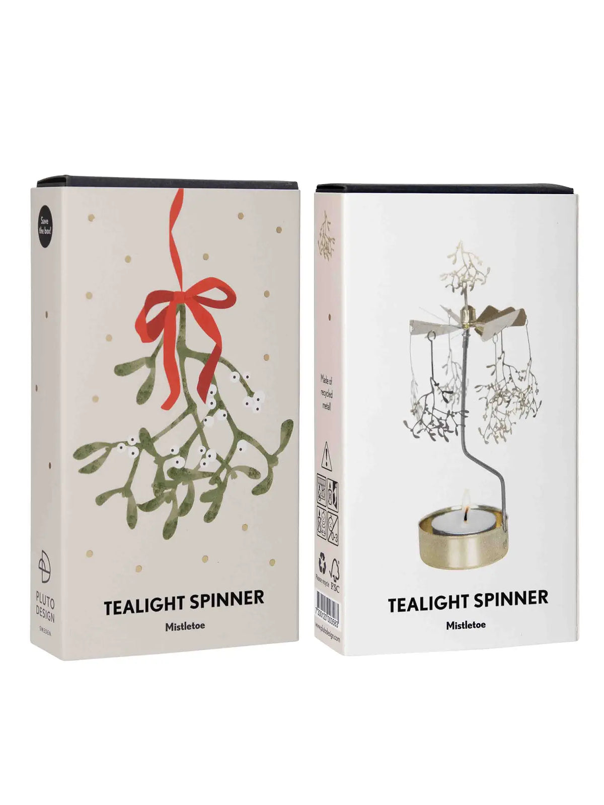 Two boxes of Pluto Design Sweden’s Tealight Spinner, Mistletoe in Gold are displayed, ideal for bringing festive charm to your Christmas décor. One box showcases a mistletoe illustration accented with a red bow, while the other highlights the golden metal tealight spinner with elegant mistletoe shapes gently twirling above a glowing candle.