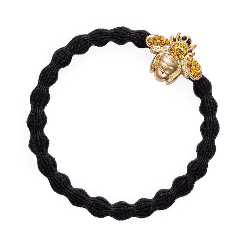 The ByEloise Bangle Band in Black features a Bling Bee Charm with yellow rhinestones, adding playful elegance to your hairstyle.