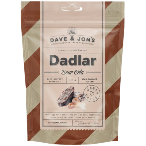 A 125g pack of Blåbär Nordic Living Dave & Jon’s Dadlar Sour Cola, sour cola flavoured dates, with a candy illustration on beige and brown stripes—a healthy, no added sugar snack.