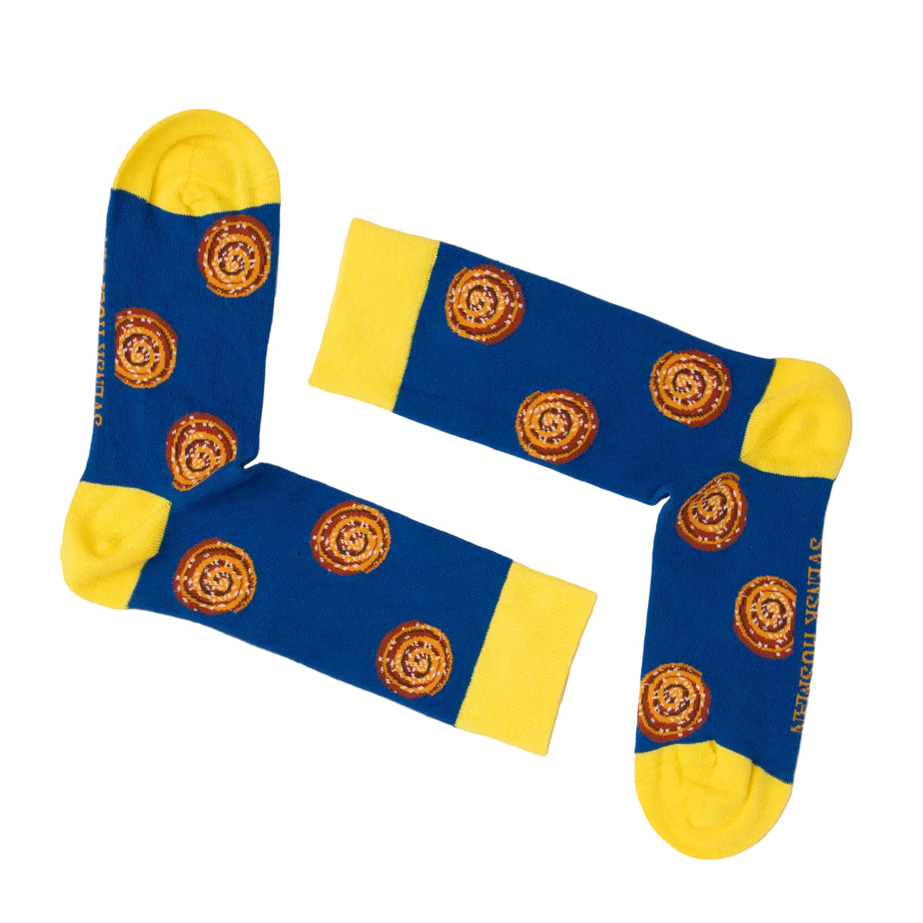 Two blue “Cinnamon Bun” Svensk Husman Socks with yellow toes, heels, and cuffs are arranged in an L shape. They feature a repeating fika-inspired circular design and have “SUPER HOUSE” printed along the side.