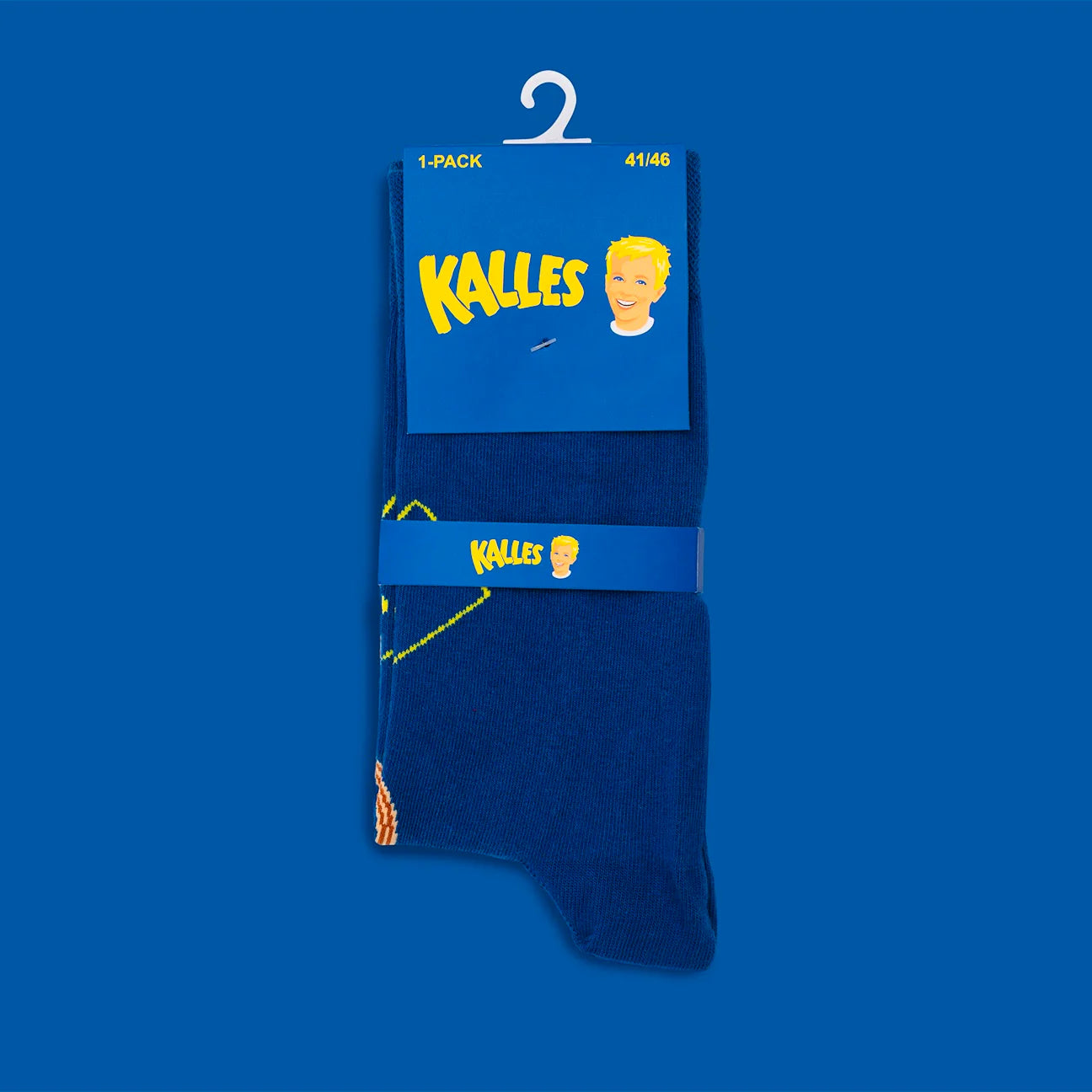A pair of Kalles Caviar The Original Special Edition blue socks from Svensk Husman Socks is folded with a blue label featuring "Kalles" in yellow and a cartoon blond boy, displayed against a blue background.