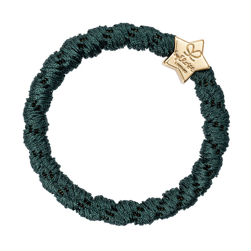 The ByEloise Bangle Band is a luxurious hair accessory, woven in bottle green with a textured finish and adorned with a small gold star charm—perfect for any occasion.