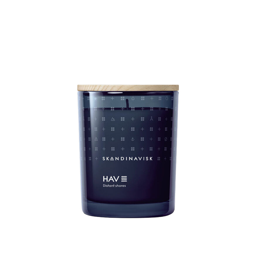 Blue candle with wooden lid and 'Skandinavisk' branding on a white background