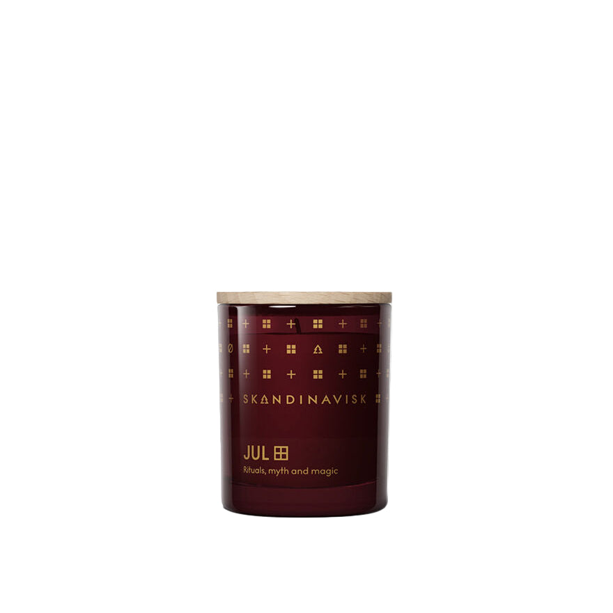 Skandinavisk candle with decorative label on a white background