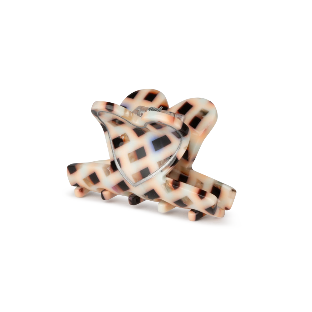 The Sui Ava Love on Repeat Mini Hair Claw Clip in Patchwork features a beige and black checkered design with a glossy finish, interlocking teeth, and a spring hinge—perfect for adding flair to any look. Photographed on a white background.