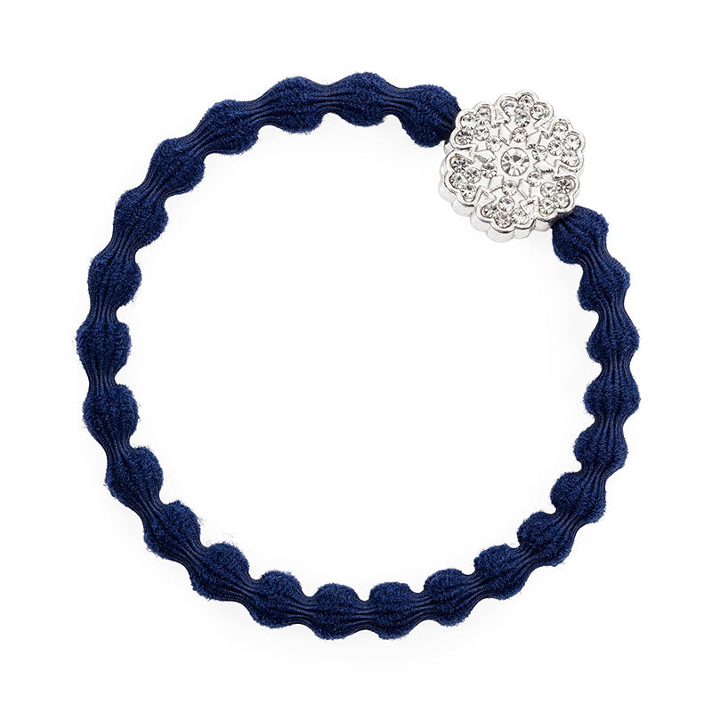 The ByEloise Bangle Band in Navy Blue features a silver snowflake charm with rhinestones—a stylish, winter-ready elastic hair tie perfect for accessorizing your look on or off the slopes.