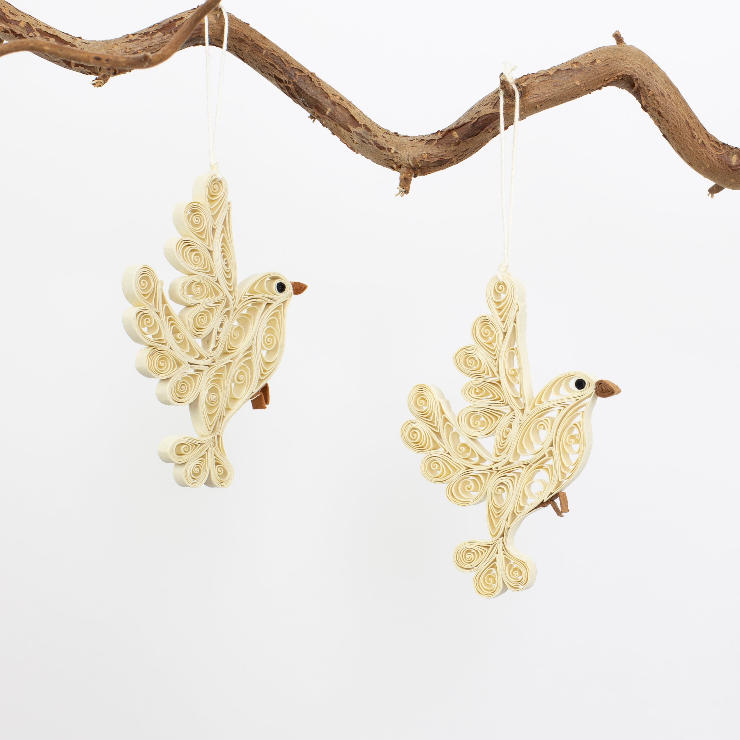 A World of Craft Quilled Dove Christmas Ornaments, 2 Pack in Beige, feature eco-friendly coiled paper birds—perfect handmade decorations for your Christmas tree.