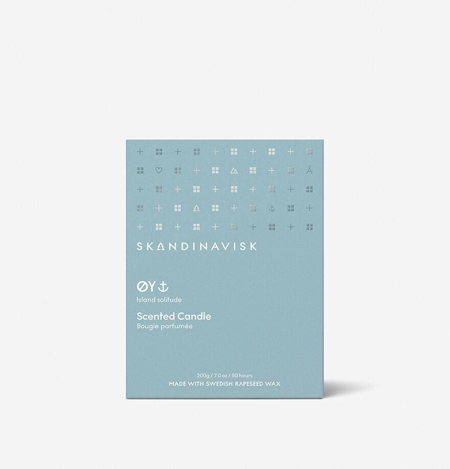 A light blue 200g Skandinavisk Scented Candle Øy box, labeled Island solitude, with small white icons and text, made from Swedish rapeseed wax.