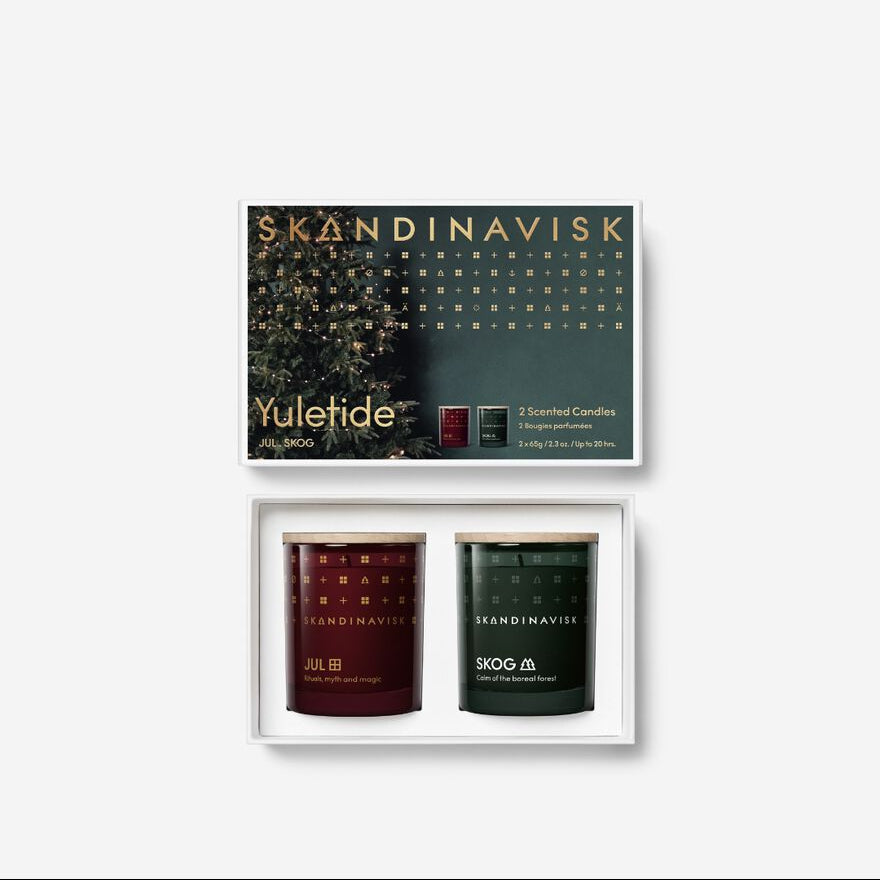 Two scented candles in a Skandinavisk box on a white background