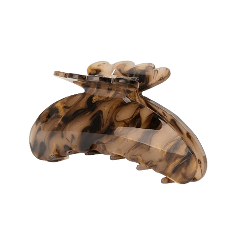 The Sui Ava Helle Pretty Big Hair Claw Clip in Champagne features a curved design ideal for styling thick hair, showcased against a plain white background.