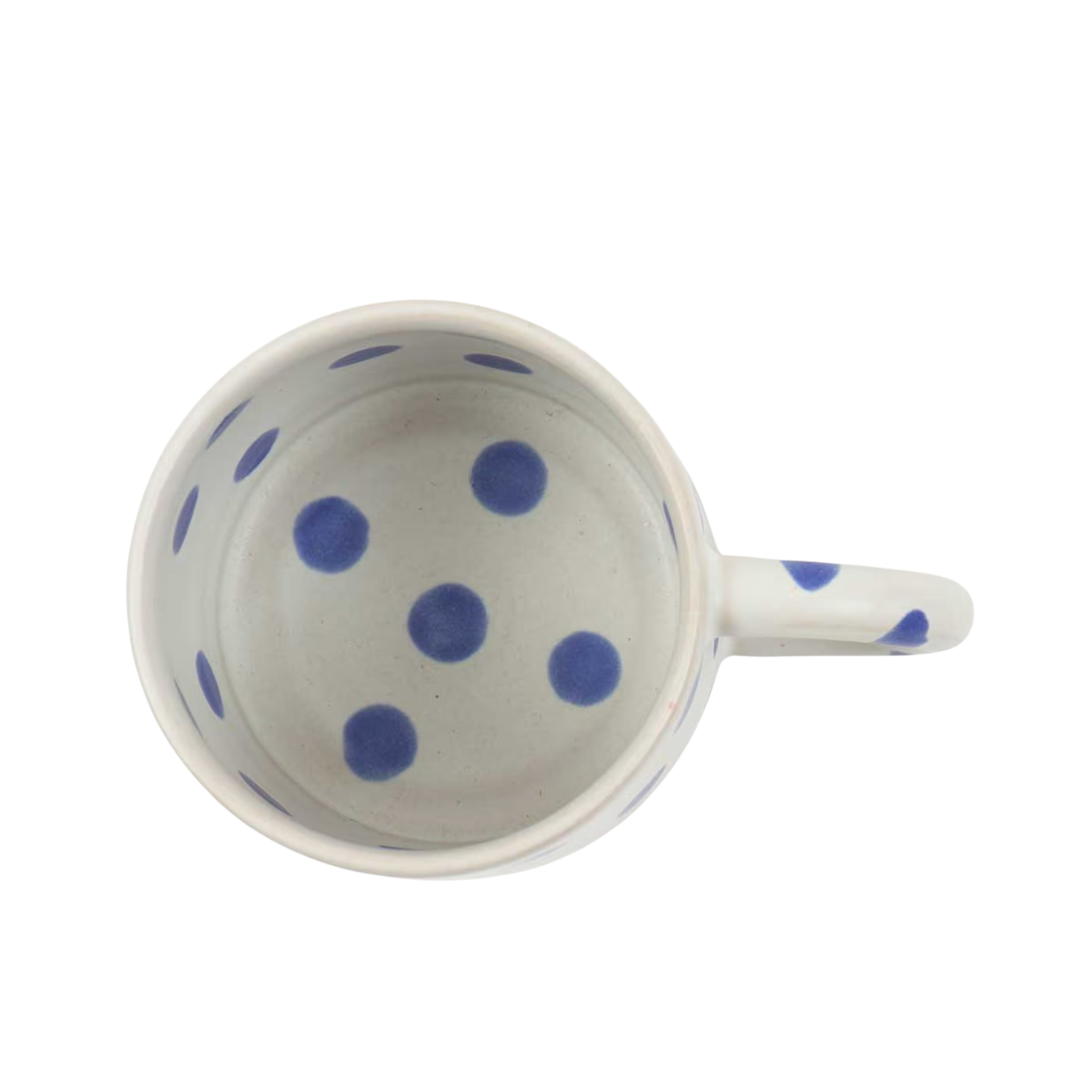 A top-down view of A World of Craft’s Coffee Mug Blot, Handmade in Blue—stoneware mug with a handle, featuring large blue polka dots inside and out.
