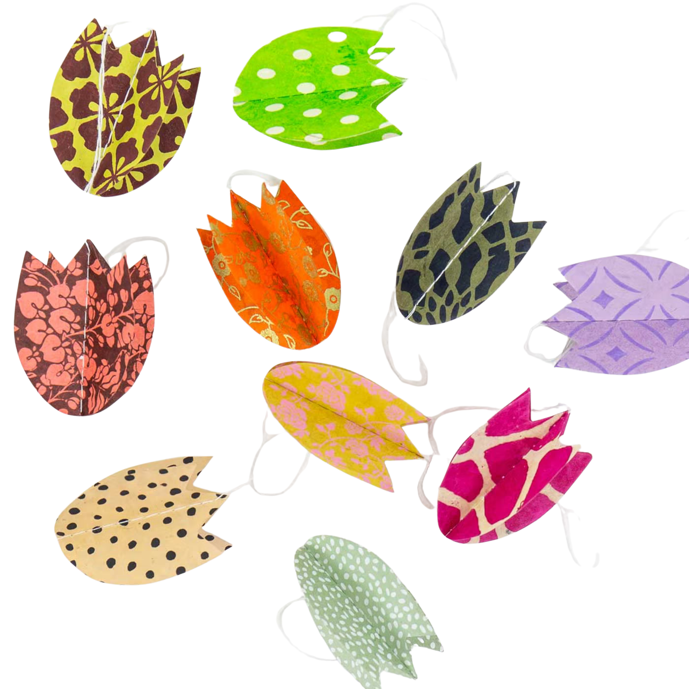 A World of Craft’s Tulip Easter Ornaments in Paper, Set of 10, features colorful cut-out tulip shapes with polka dots and geometric patterns—perfect for scattering as handmade decorations this Easter.