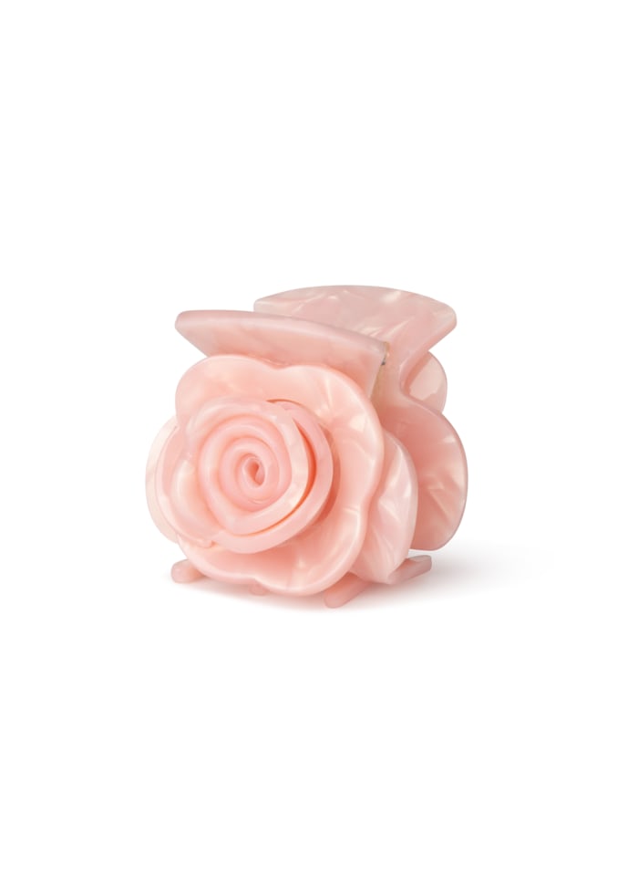 A millennial pink Rosie Mini Hair Claw Clip in the shape of a rose.