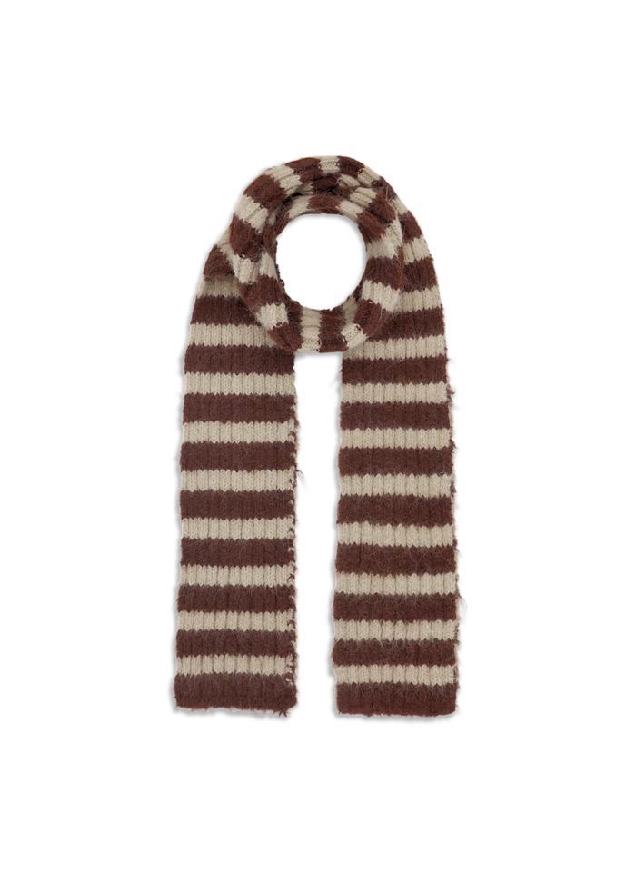 The Clara Slim Scarf in Brown and Beige by Sui Ava is a long, knitted accessory featuring horizontal brown and beige stripes, laid flat on a white background; this modern statement piece effortlessly blends timeless style with contemporary flair.