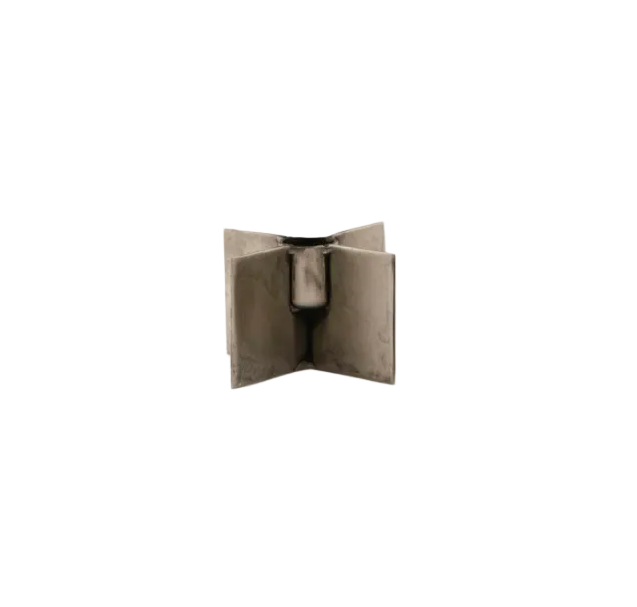 The Candle Stand Wing by House Doctor is a small, raw iron candle stand with four flat rectangular panels in a cross shape, standing upright against a plain white background.