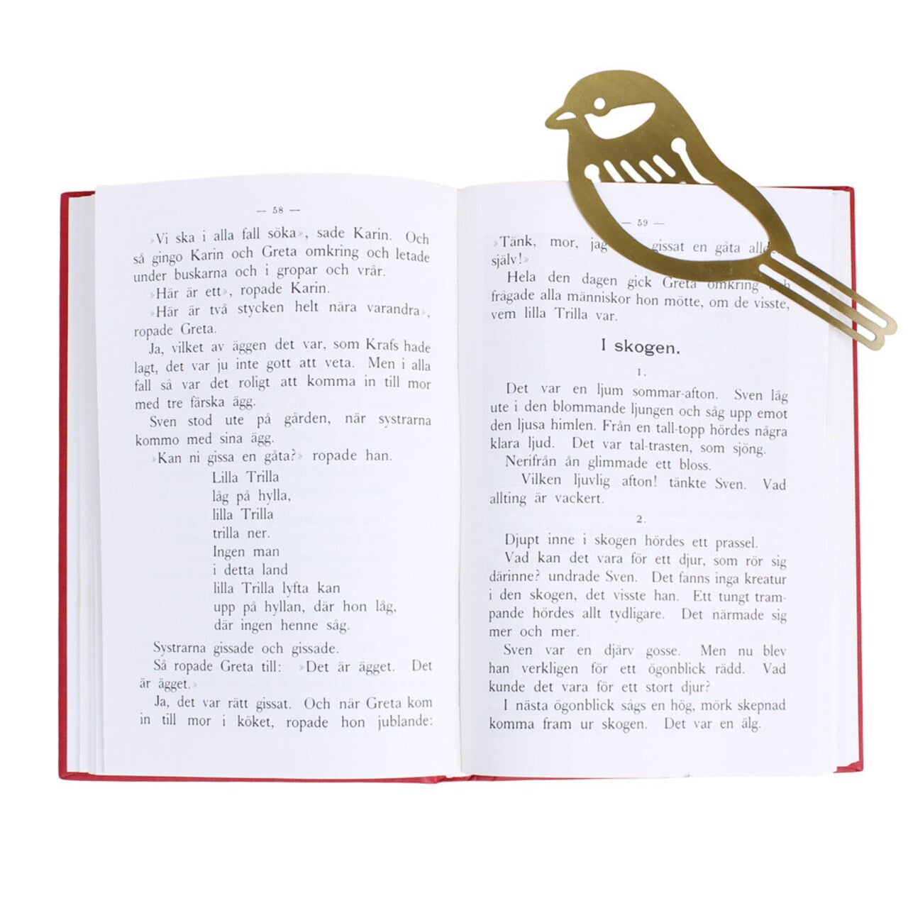 An open book with Swedish text lies flat, featuring the Strömshaga Book Marker Bird in Brass clipped to the top right corner—a charming, metallic reading accessory.
